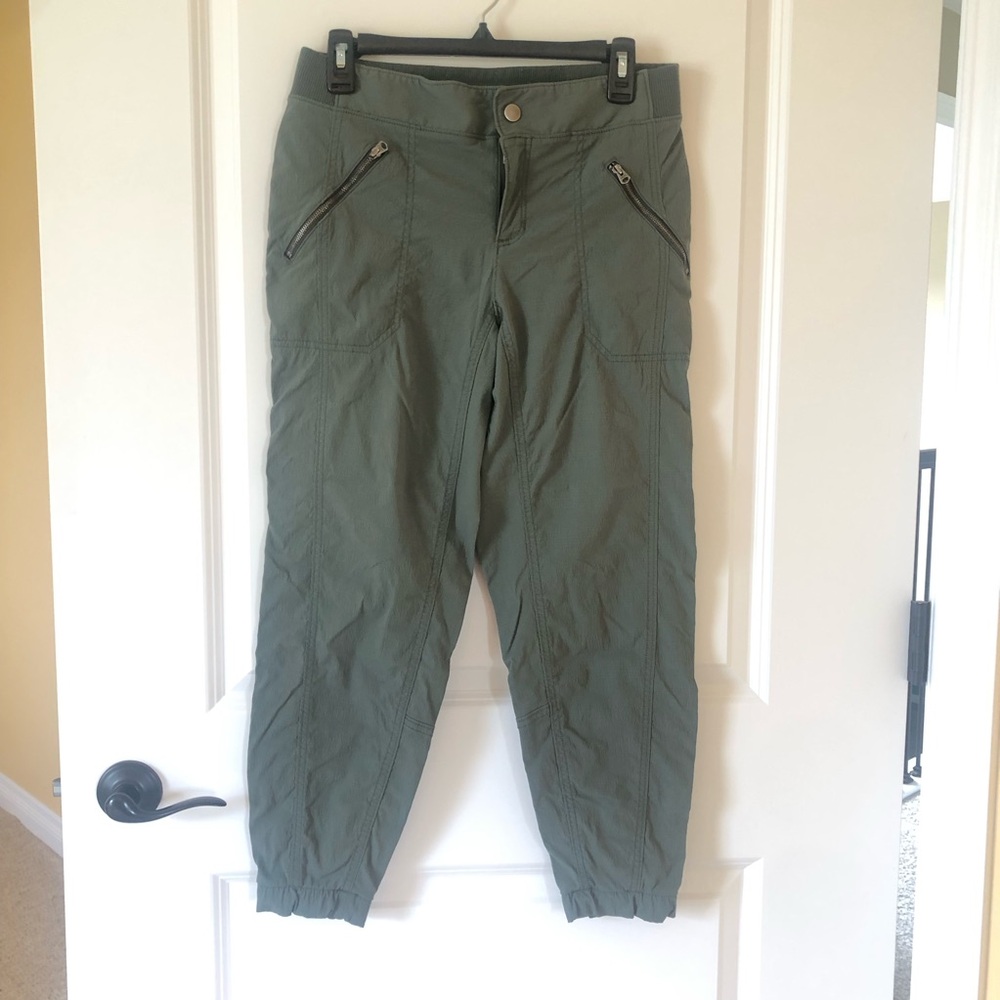 Athleta Army Green Joggers. Size 10. Elastic waistband in back. Zippered pockets